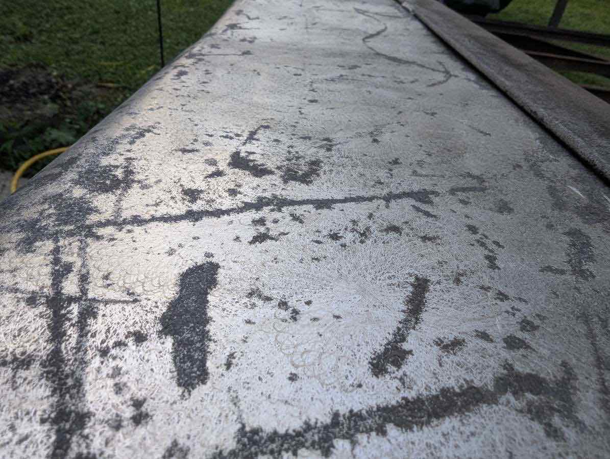 After laser cleaning: the steel surface restored to bright, clean metal.